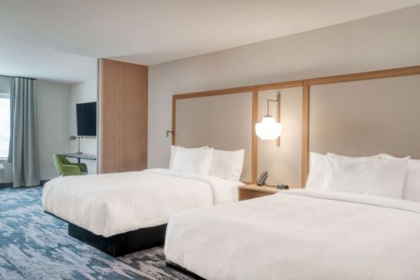 A hotel room with two beds, a desk, a chair, a TV, and a lamp. - Minutes to KFC Yum! Center + Free Breakfast & Gym (Shelbyville)