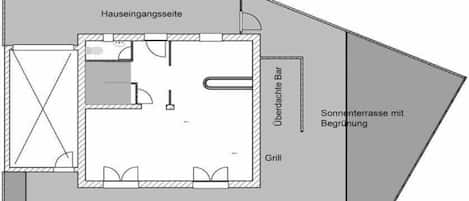 A floor plan of a building with a central living area, a balcony, and a sun terrace.