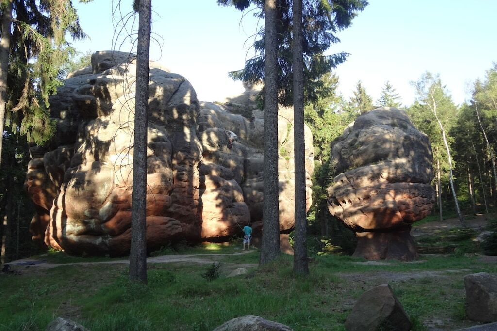 A natural landscape with large rock formations and trees.