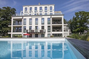 A multi-story hotel named 'Villa Augustine' with a swimming pool in front. - Paradise Cloud at Villa Augustine (Ostseebad Binz)