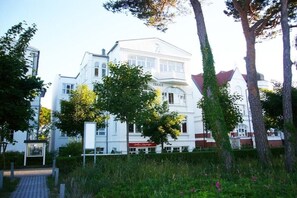 A white building with a sign that reads 'FRIGGA.' - "Nymph" in the Villa Frigga (Binz)
