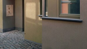 A building facade with a window, a door, and a wall-mounted control panel. - Holiday Home - Cityhouse WG9 - 6 Guests - 3BR (Marktheidenfeld)