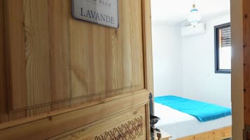 A wooden door with a sign reading 'PEAK BLUE ATLAS LAVANDE.'
