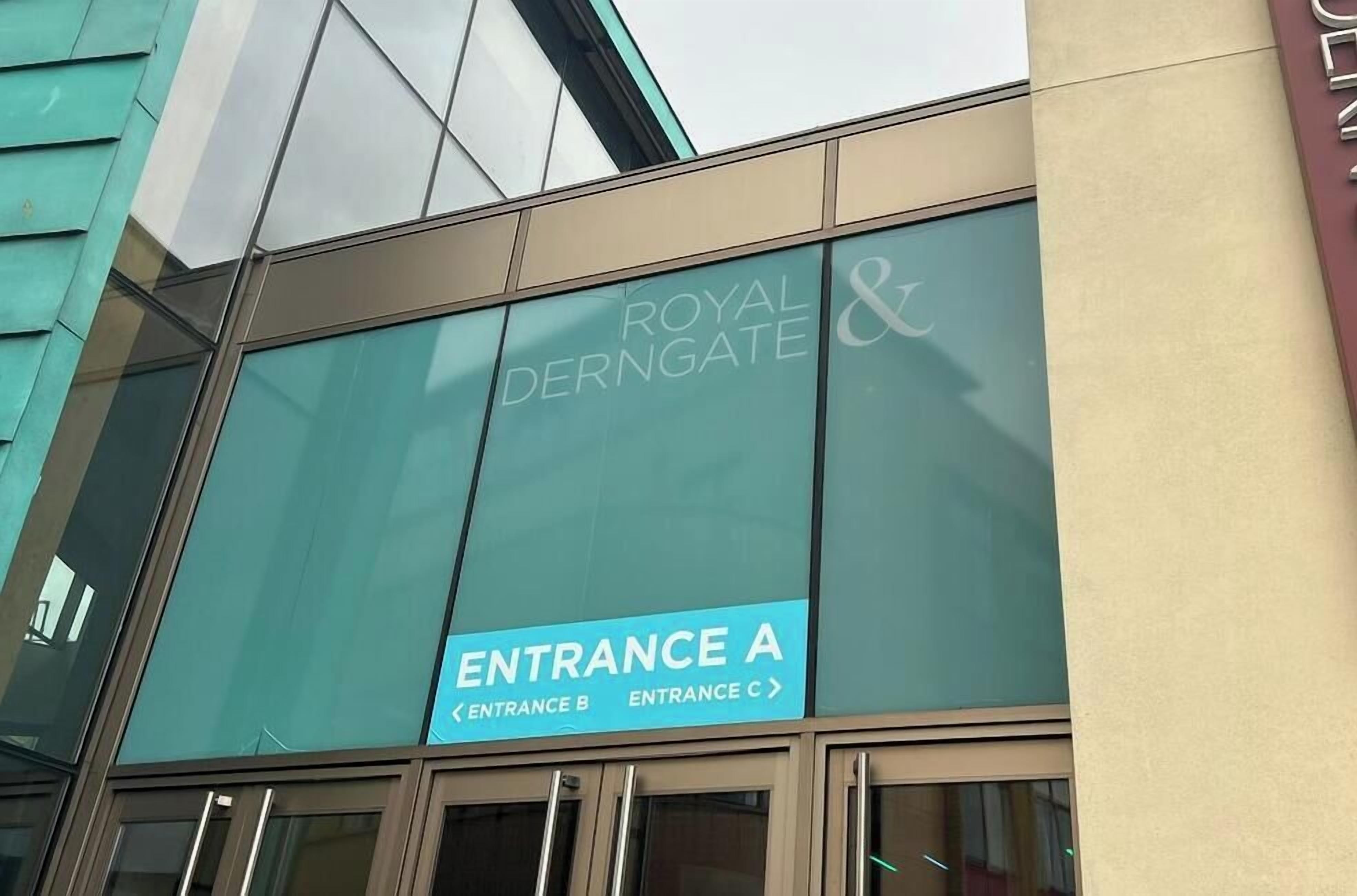 A building facade with the sign 'Royal Derngate &' and 'Entrance A' indicating the location of the entrance.