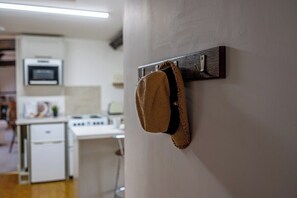 A kitchen with a microwave, stove, and refrigerator.
