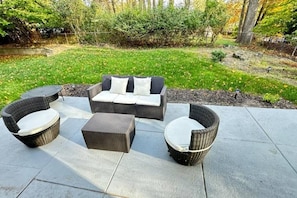 An outdoor patio with a sofa set, two armchairs, and a coffee table. - Urban Xcape- Family Vibe With Plush Amenities (Silver Spring)