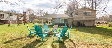 A residential property with a backyard patio area featuring outdoor seating.