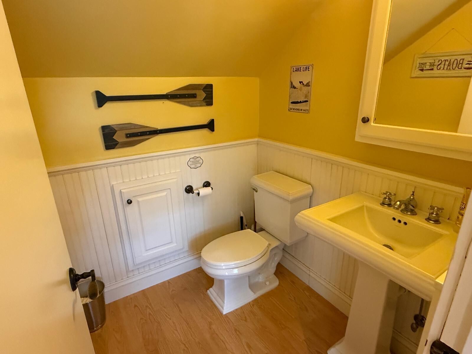 A bathroom with a toilet, bidet, and sink.