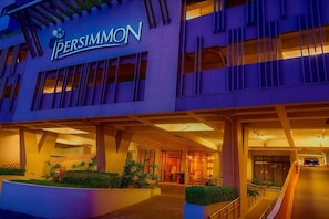 A hotel entrance with a modern design, featuring a prominent sign and a covered walkway. - Near Sm And Ayala persimmon condo (Cebu City)