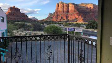 A gated entrance with a view of red rock formations and a sign for 'Bead Heaven Christmas Gifts.'