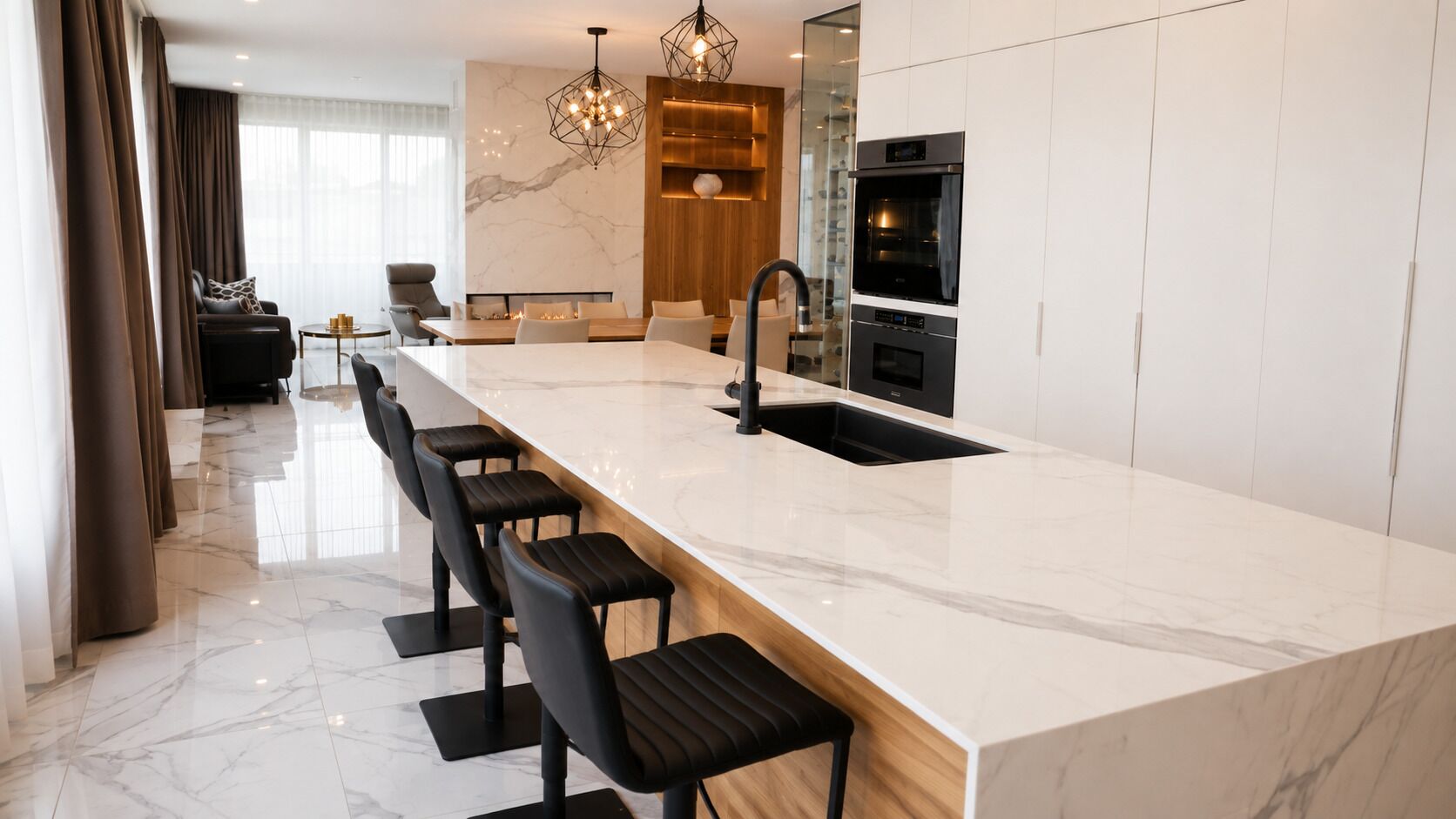 A modern kitchen with a marble countertop, black bar stools, a built-in oven, and a large window.