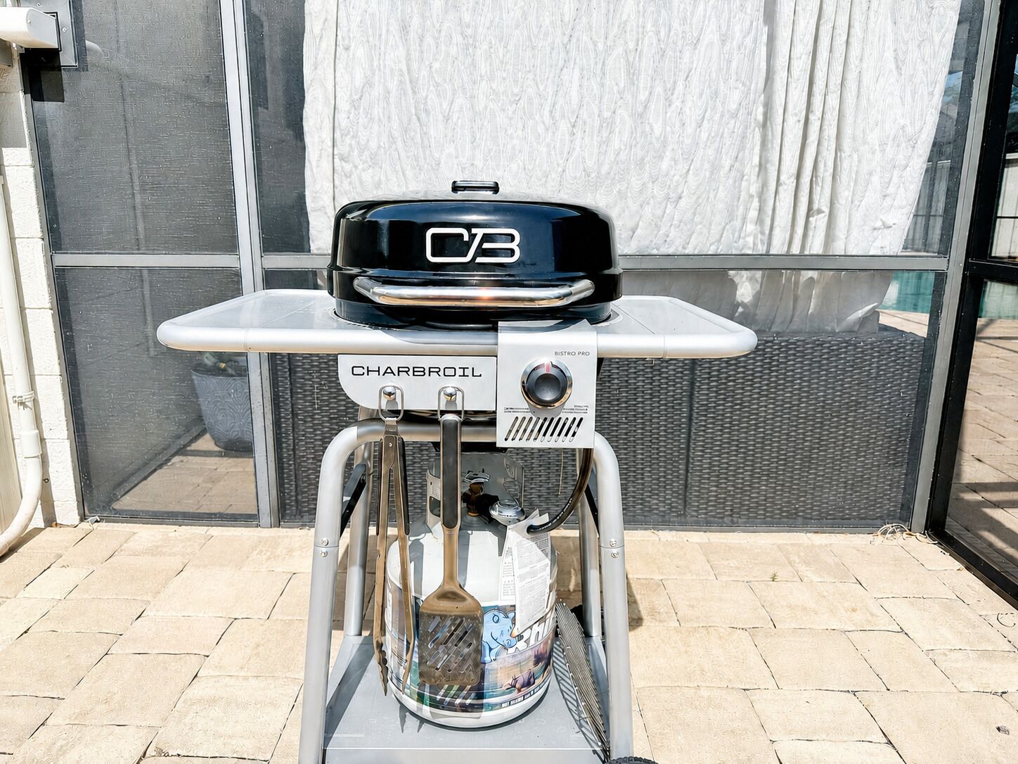 A Charbroil grill with a digital thermometer and a BISTRO PRO control unit.