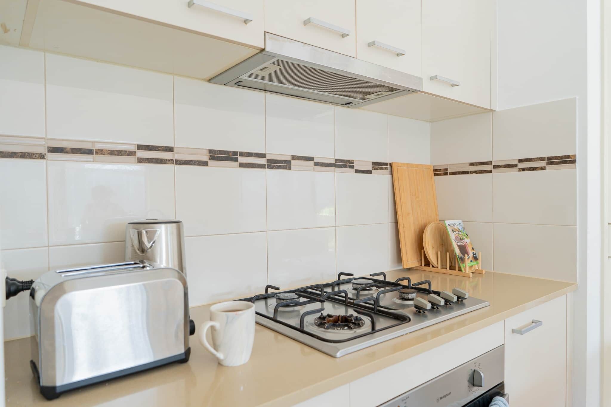 Coffee/tea maker, fridge, microwave, oven