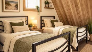 A bedroom with two beds, a window with blinds, a shelf with a plant, and a framed picture on the wall.