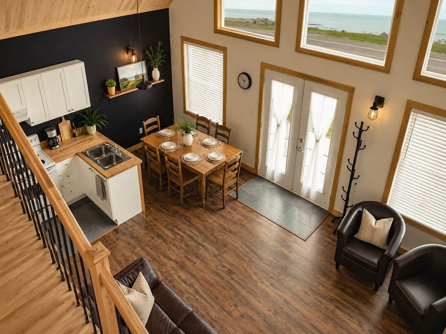 A compact living space with a kitchen, dining area, and seating.