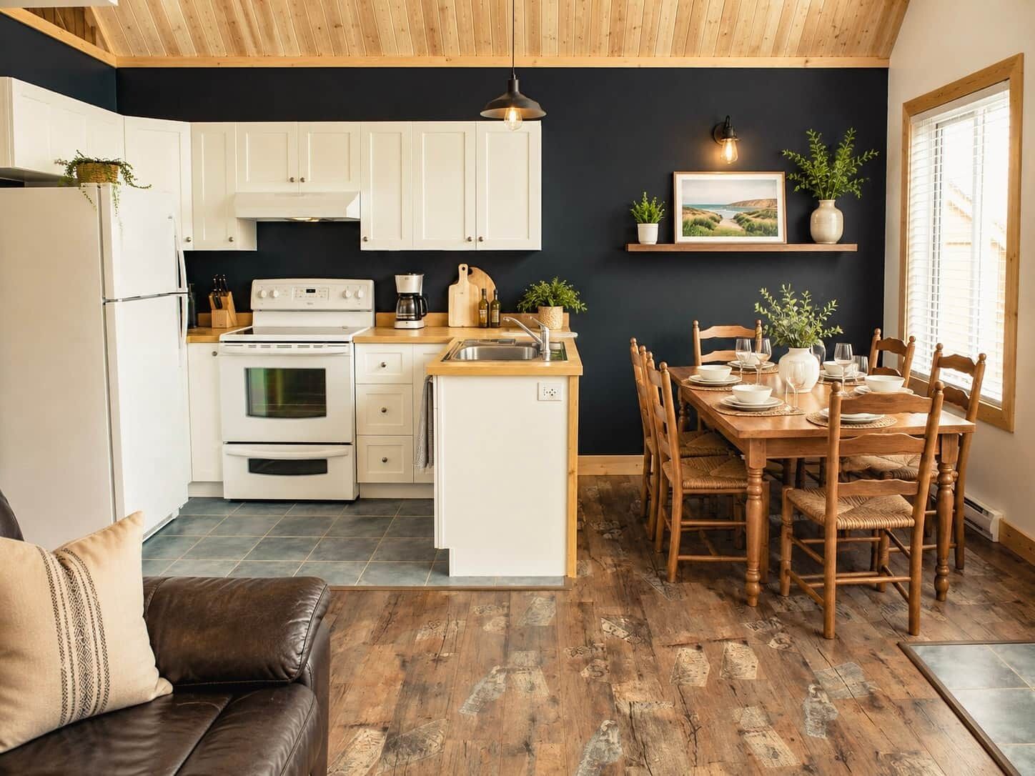 A modern kitchen with white cabinets, a built-in oven, and a dining area with wooden chairs and a table set for four.
