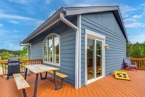 A house with a deck, a barbecue grill, and a table. - Blue Sky Retreat w/ 3rd-Floor Mtn Views, Starlink (Bailey)