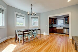 A modern kitchen with wooden cabinets, a built-in oven, and a stainless steel dishwasher. - Walk to Capitol Campus! 'Stellar & Bloom Olympia' (Olympia)