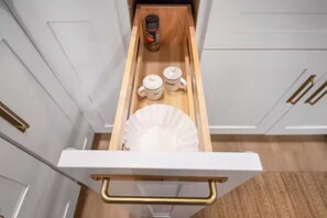 A kitchen drawer with utensils, a spice jar, and two containers. - Outdoor Movie Theater/ Private POOL & Hot Tub/ Fun (Ocean Isle Beach)