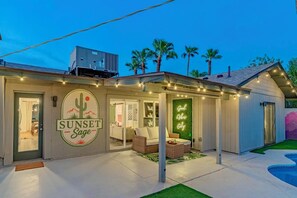 A building with a logo 'SUNSET Sage' and a neon sign 'Good Vibes Only'. - 6 bdrm/ 5bdrm in Old Town Scottsdale with Casita, Game Room, and Pool! (Scottsdale)