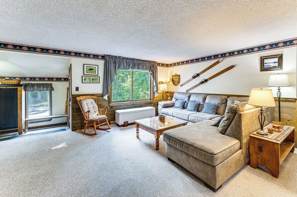 A cozy living room with a fireplace, a rocking chair, a sofa, and a coffee table. - Walk to Echo Lake State Park! Family Escape (Conway)