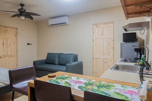 A compact kitchen with a built-in microwave, a sink, and a stove. - Walkable Uvita Studio: 1 Mi to Marino Ballena (Uvita)