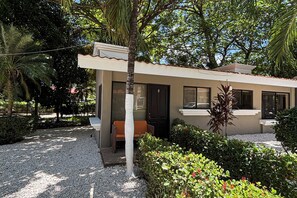 A small, single-story building with a tiled roof, a door, and a window. - Walk to Beach! Studio w/ Pool Access at Club Voca (Playas del Coco)