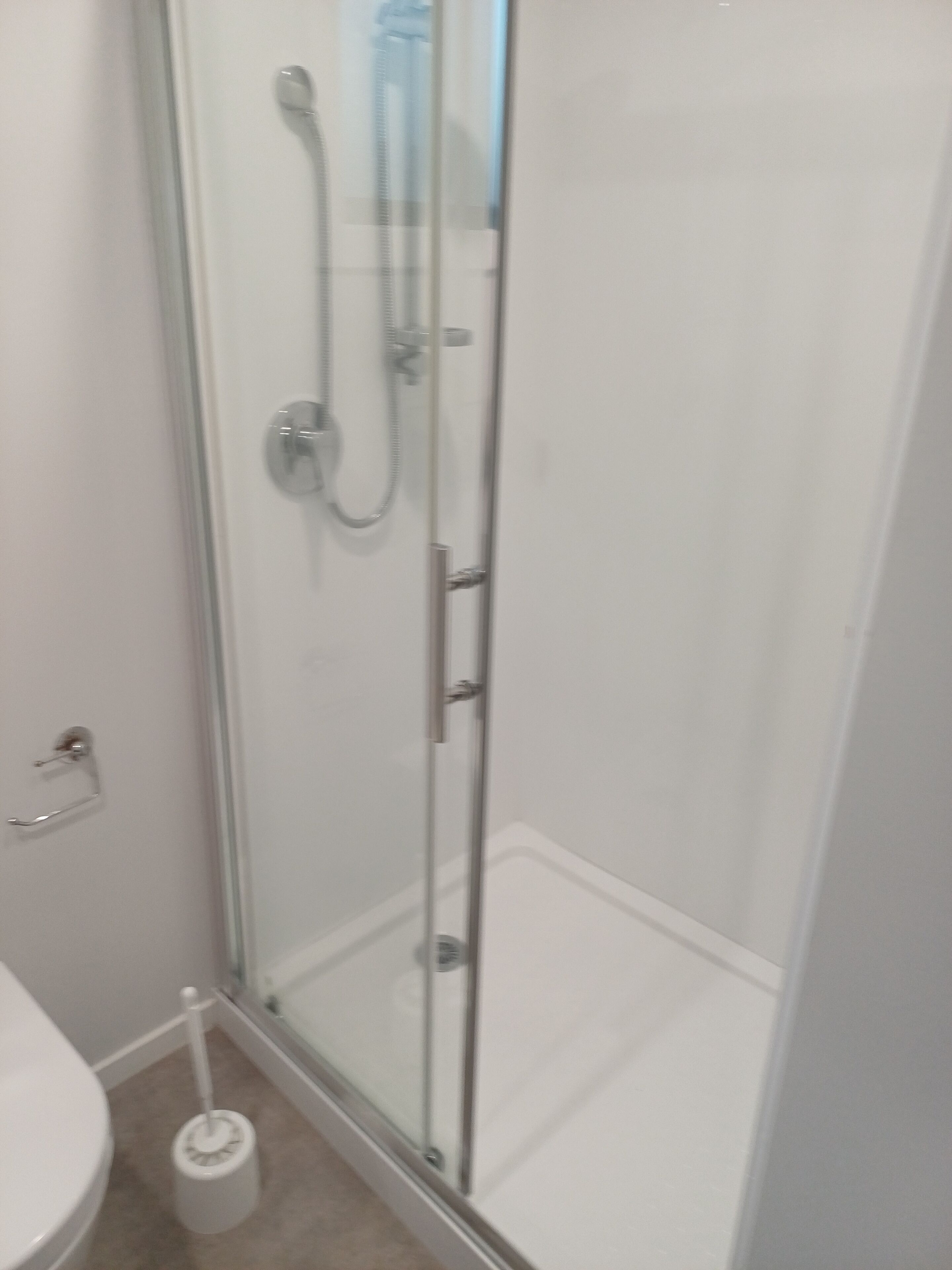Shower, towels, soap, toilet paper