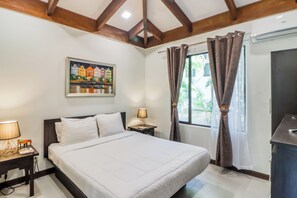 A hotel room with a bed, nightstands, a lamp, a painting, and a window with curtains. - Villa Sol Resort Gem w/ Soaking Pool & Views! (Playa Hermosa)