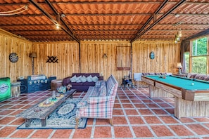 A cozy room with a pool table, a sofa, and a dartboard. - Dog-Friendly, Secluded, Game Room: Dota Mountain (Dota)