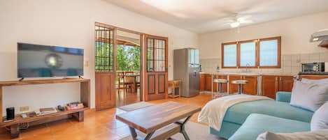 A modern kitchen with a refrigerator, oven, and a built-in microwave.