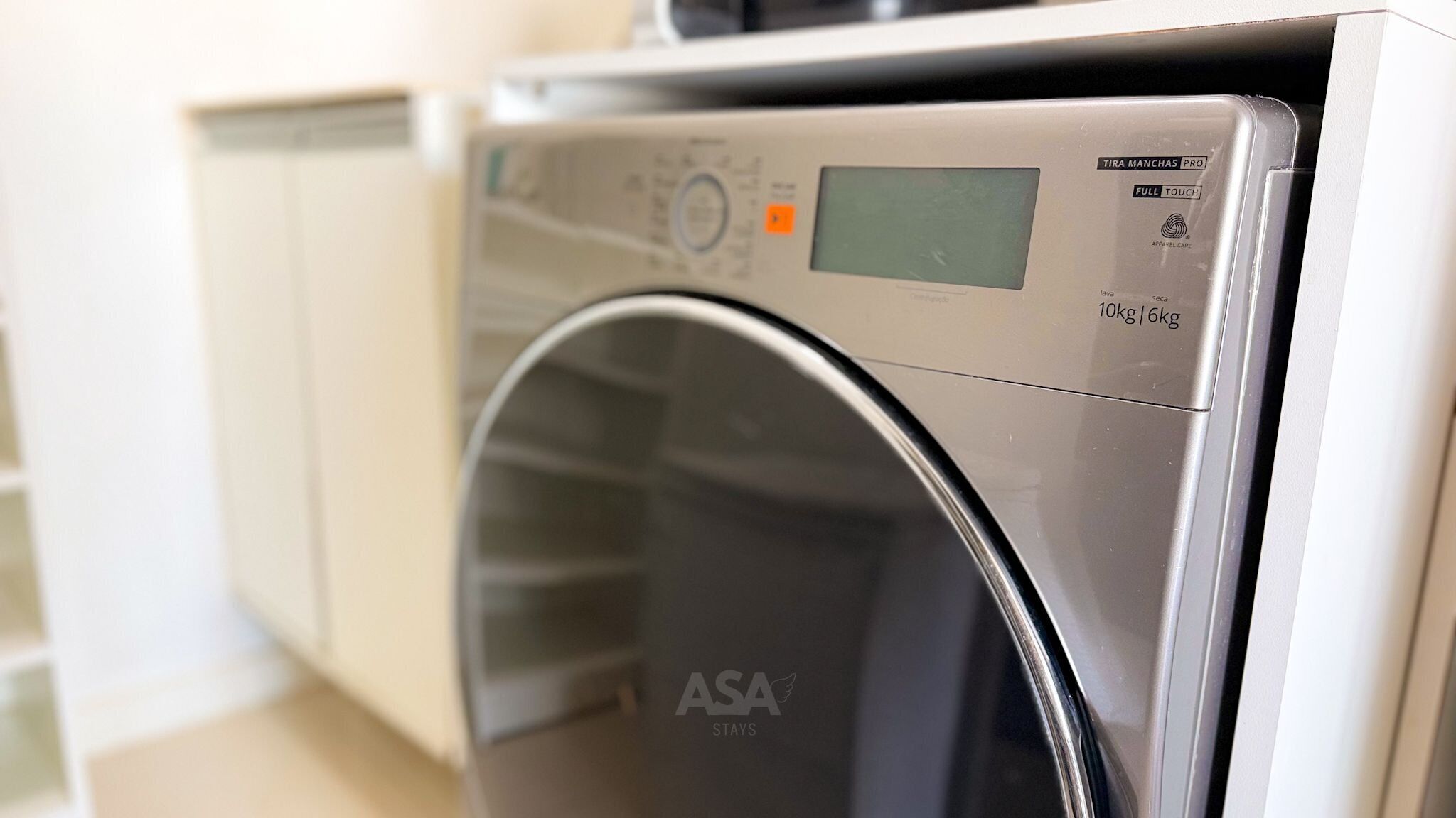 A front view of an ASA brand washing machine with a digital display and control panel.