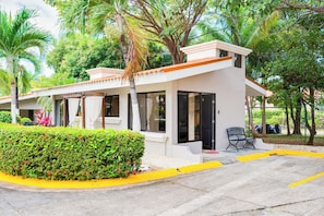 A modern building with a flat roof, large windows, and a door. - Step-Free Studio w/ Pool Access, Walk to Beach! (Playas del Coco)