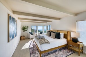 A bedroom with a large bed, a view of the outdoors, and a window with a view. - Sonoma Skyhouse l Pool Hot Tub Sauna Views (Sonoma)