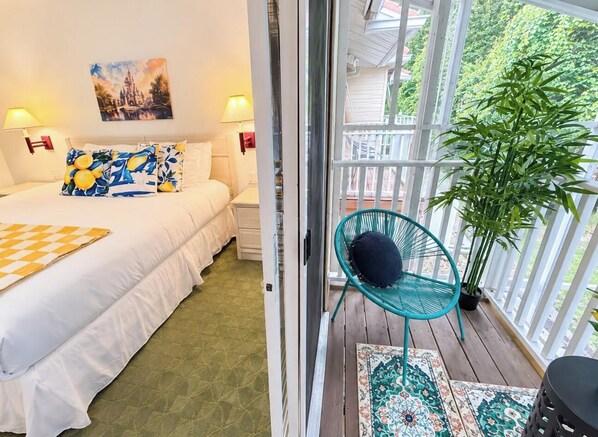 A bedroom with a bed, pillows, a nightstand, a lamp, and a painting on the wall. - 20 Min to Disney World | 4BR Pool Home (Kissimmee)