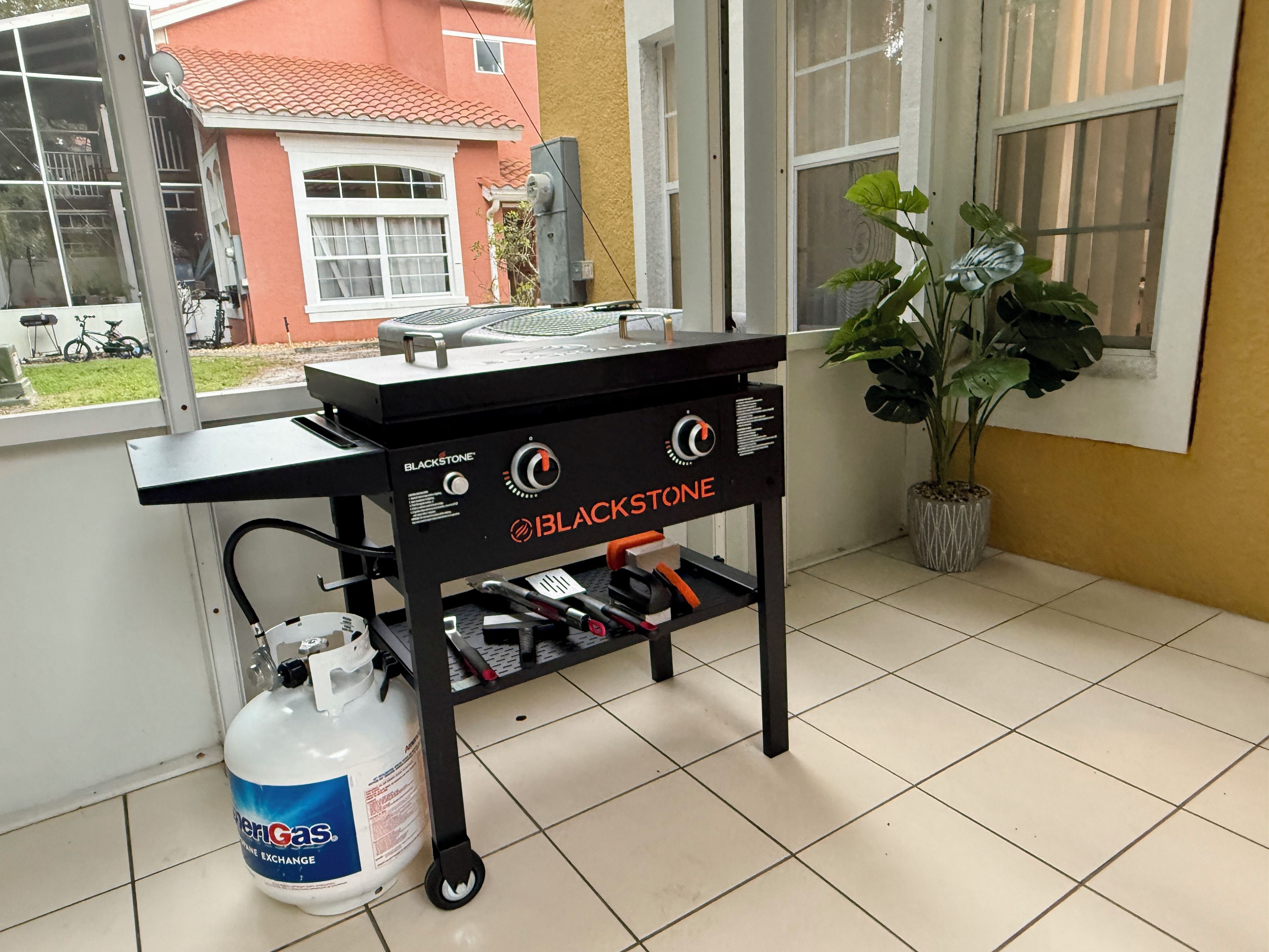 Screened patio with Blackstone grill for easy outdoor cooking