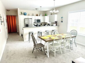 A modern kitchen with white cabinets, stainless steel appliances, and a central island. - 3BR/2BA Charleston Home – Minutes to Downtown & Folly Beach! (Charleston)
