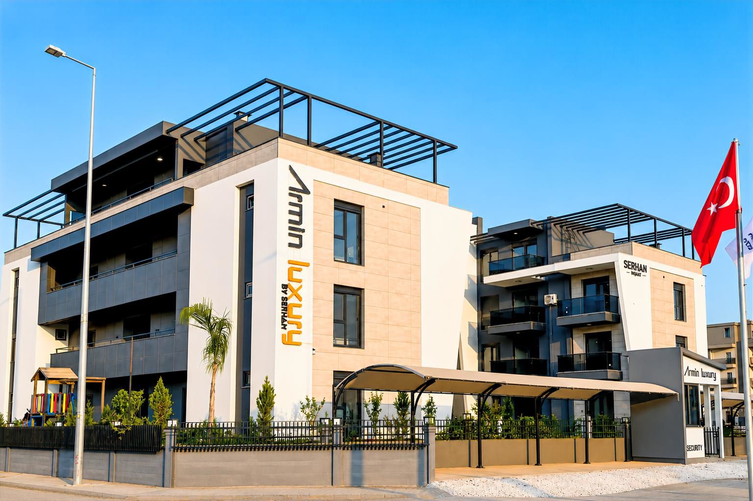 A modern building with a prominent sign for 'Serhan Luxury by Serhan.'