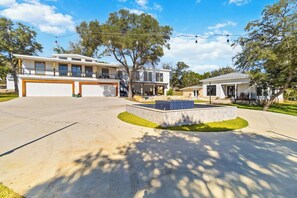 A residential property with a spacious driveway, a patio area, and a swimming pool. - 2 Homes on Boerne Acreage w/ Fire Pit & Hill Views (Boerne)