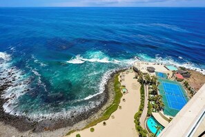 A coastal resort with a beach, a pool, and a tennis court. - 16th-Floor Oceanfront Condo with Stunning Sunset Views (Playas de Rosarito)