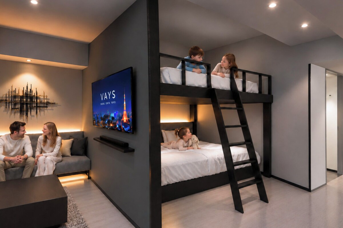 A modern interior with a bunk bed, a flat-screen TV, a sofa, and a coffee table.