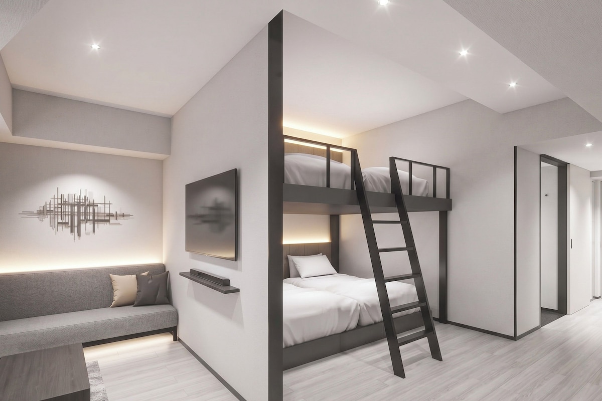 A modern bedroom with bunk beds, a flat-screen TV, and a minimalist design.