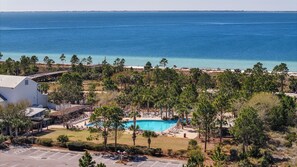 A resort with a swimming pool, beach access, and a view of the ocean. - Brand-New 4-Bedroom Coastal Escape in WindMark Beach (Port St. Joe)