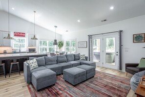 Living room with the kitchen close at hand - Cloudland Summit | Hot Tub + Grill | Dog Friendly (Rising Fawn)