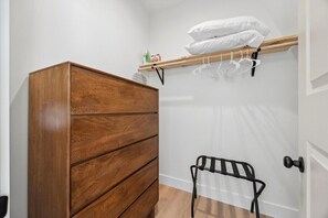 Bedroom closet with a dresser and hanging space - Sunset Peak | A-Frame Bohemian Design | Hot Tub! (Rossville)
