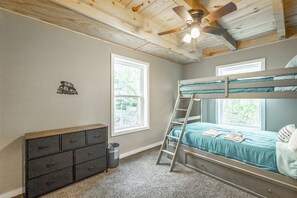 Bunk bedroom with dresser storage