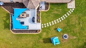 A rooftop deck with a seating area, a small garden, and a pathway leading to the house. - Lake Hills Landing | Family Friendly+Hot Tub+EV (Trenton)