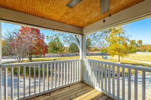 A covered porch with a wooden ceiling and white railing. - Hemlock Hill | Large Home | Mtn Views | Sleeps 23! (Rossville)