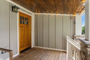 A wooden front door opens into your cottage getaway - The Greenwood Cottage | Hot Tub + Near Downtown! (Chattanooga)