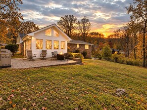 A house with a patio, outdoor seating, and a fire pit. - The Wrenley Chateau | Great Location + Backyard! (Ringgold)